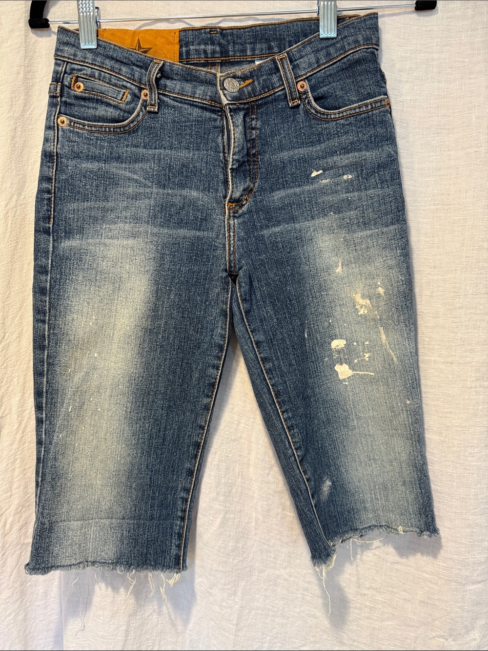 Rock & Republic Distressed Bermudas with Frayed Hem and Paint Splatter size 25